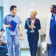 Nurses walking in the hall and talking.